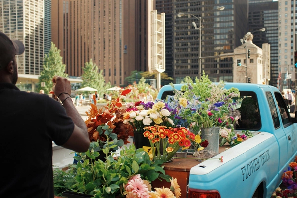 colourful flowers in a blue delivery truck