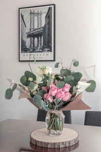 pink/green/white flower bouquet in a vase